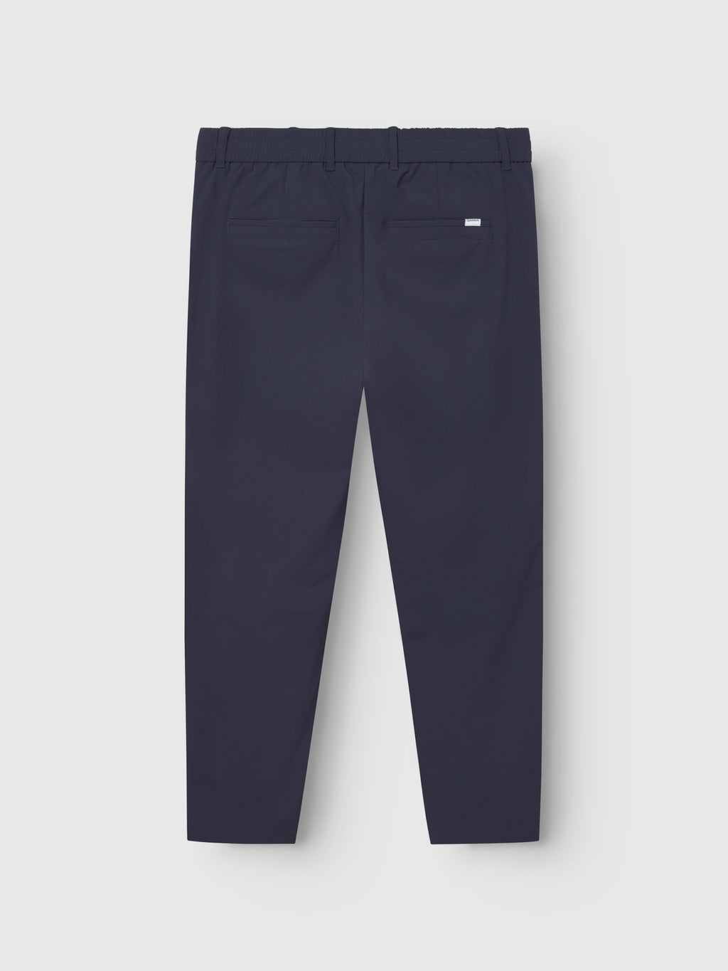 The Monza Tech - Navy trousers by Gabba feature a relaxed straight fit, an elastic waistband, and two back pockets. Made from tech fabric, these navy blue pants are displayed flat on a light grey background.
