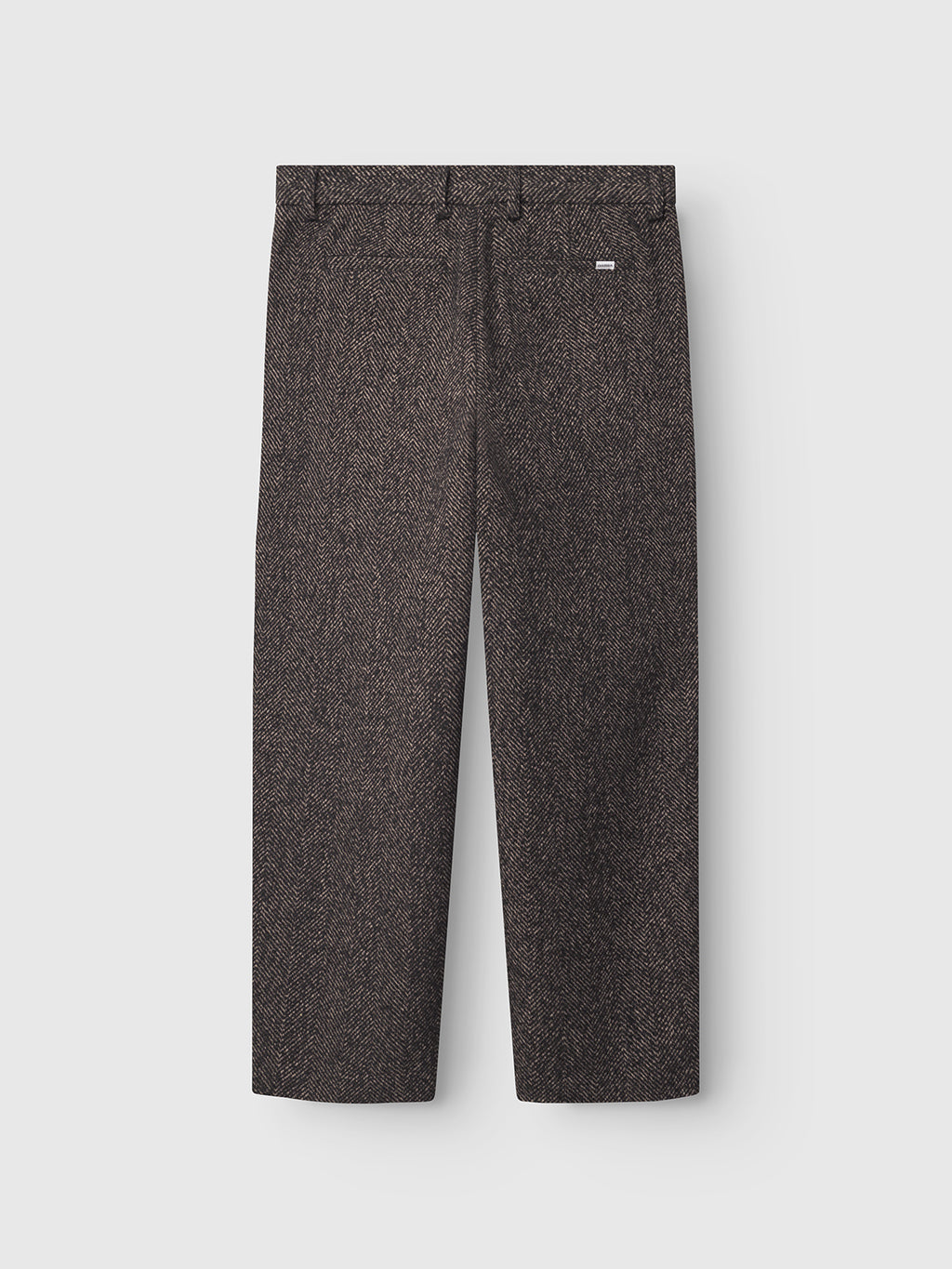 The Gabba David Wide - Brown trousers are straight-leg tweed pants with belt loops and a small logo tag near the waistband, shown laid flat on a light gray background.