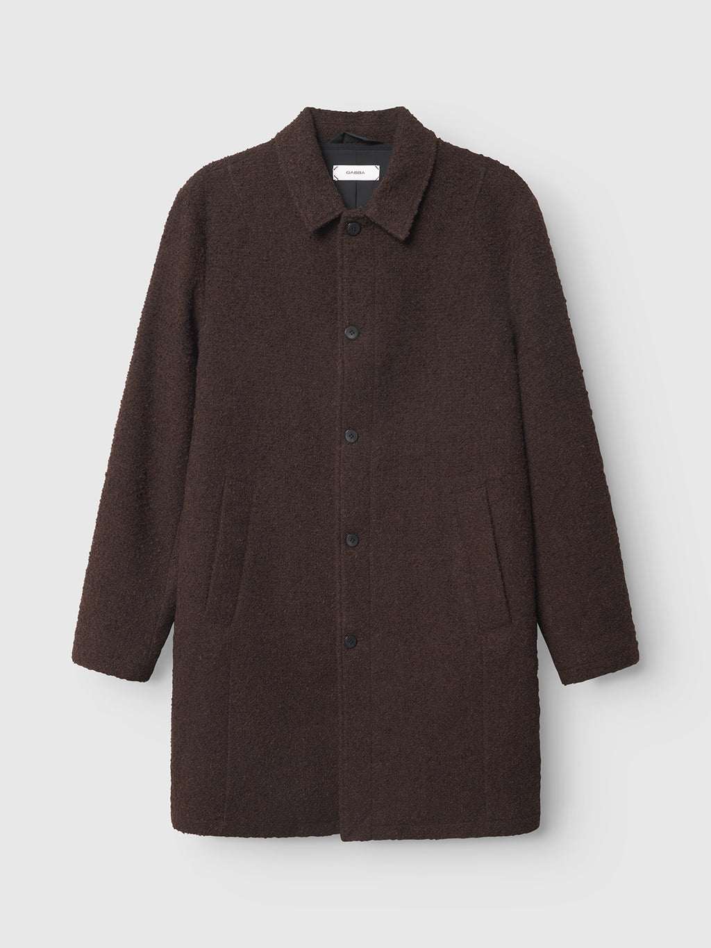 The Gabba Milano Boucle - Brown is a dark brown, knee-length wool coat with a collar, button-up front, and two side pockets, shown against a plain light background.