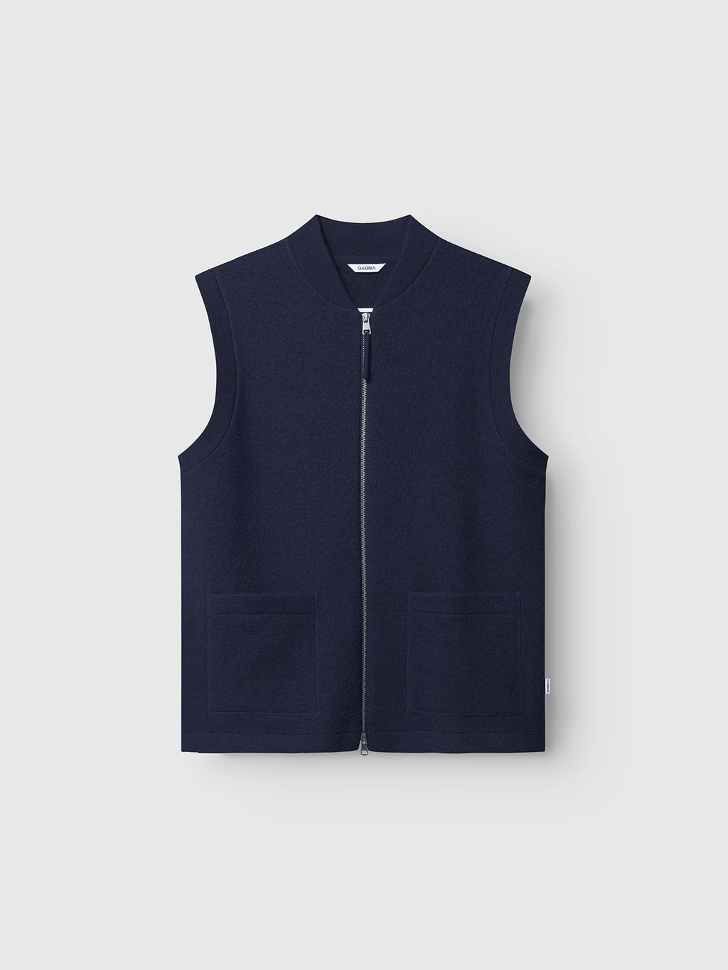 The Gabba Norwich Led - Navy is a sleeveless utility vest with a full front zipper and two front pockets, shown on a plain light gray background—ideal for layering.