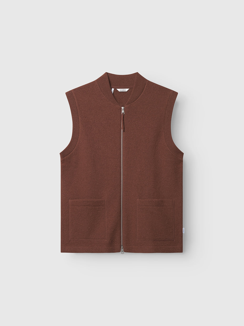 The Gabba Norwich Led - Brownish is a sleeveless wool vest with a high collar and two front pockets, perfect for layering. It is shown against a plain light background.