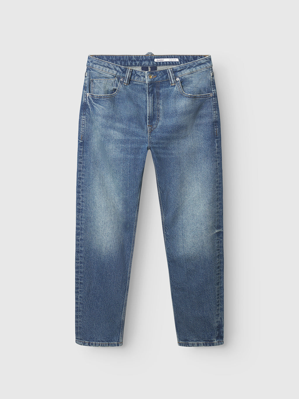 Gabba’s Carl Oskin - Dark Blue Denim jeans feature a classic five-pocket style, loose tapered fit, and straight legs with subtle fading at the thighs and knees, shown on a plain white background for easygoing style.