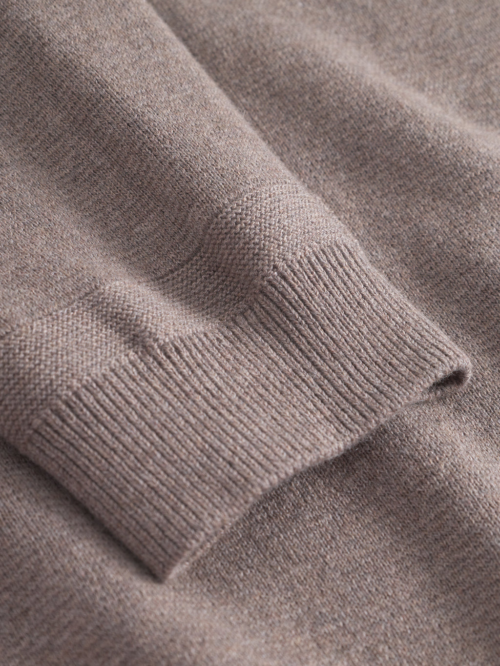 Close-up of the Blanko New LS sweater by Gabba in Sand Mel, highlighting the ribbed cuff and soft, textured knit—ideal for breathable, transitional layering.