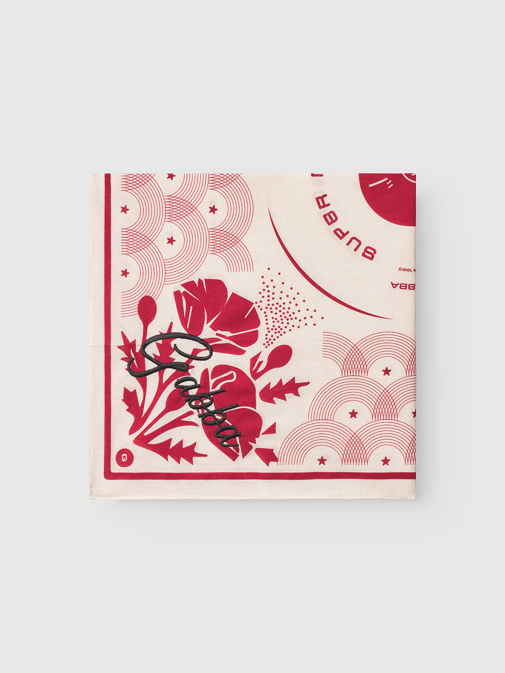 The Bandana Waves - Multi Pattern by Gabba is a folded cream cotton bandana featuring retro floral and star designs with black Sub Pop cursive text in one corner.