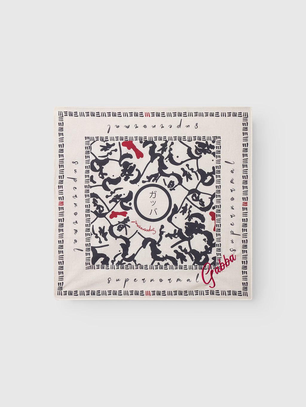 A square white box featuring black abstract and calligraphic patterns, red details, and Gabba in red script at the lower right. Japanese-inspired designs and characters appear at the center and along the border. Product: Bandana Yovi - Multi Pattern.