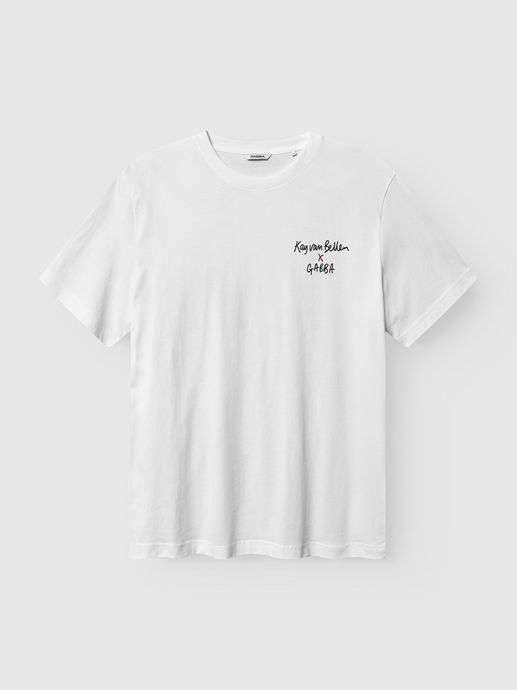 The Gabba Dune Kay Man SS GOTS - White is a minimalist, sustainably made short-sleeve tee with small black handwritten-style Keep your Belief GABBA text on the left chest, shown against a light gray background.