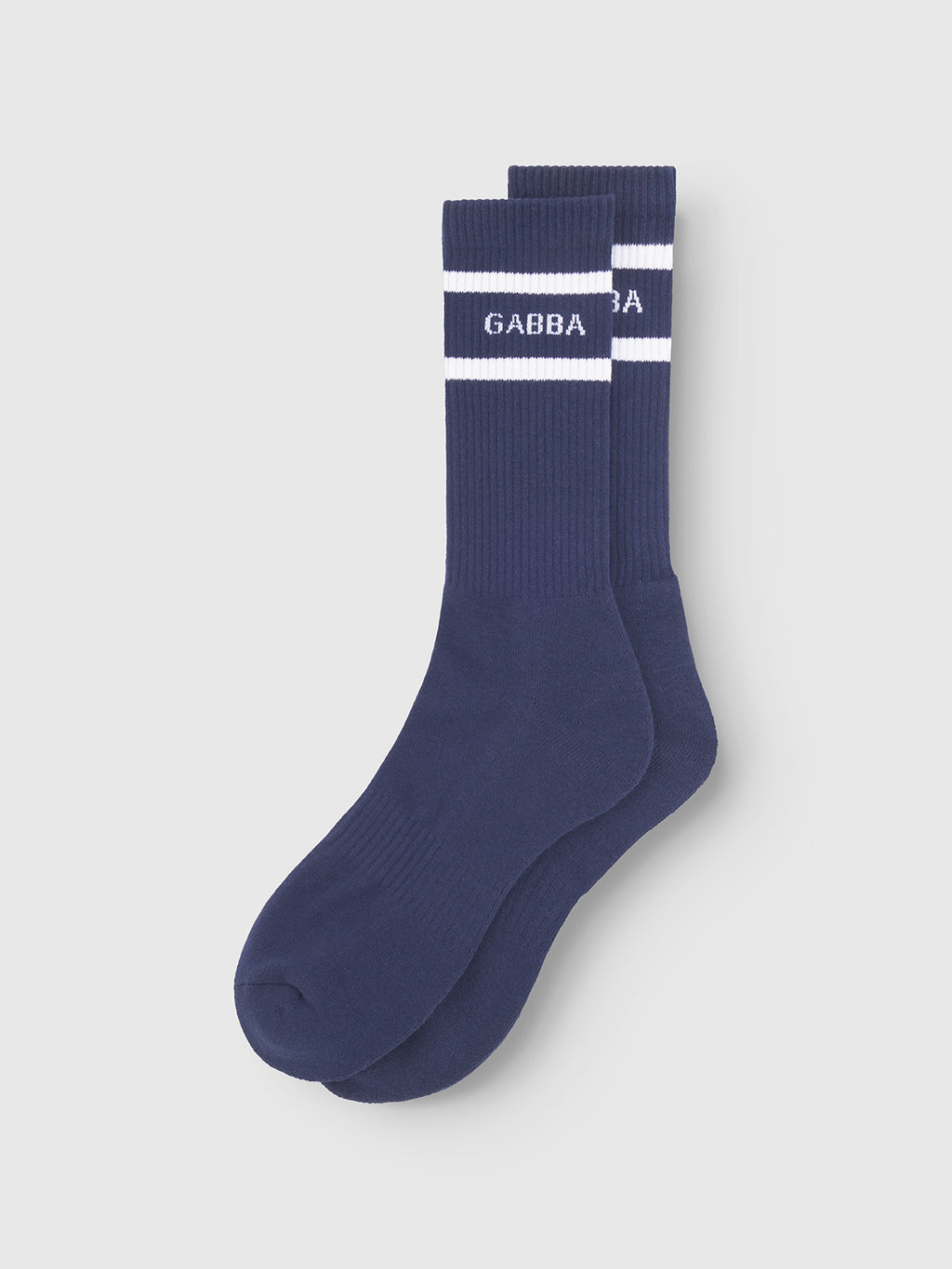 Zino Socks - Navy by Gabba: Navy cotton blend socks with white top stripes and GABBA in white on the side, shown flat on a light gray background. Ideal everyday socks for comfort and style.