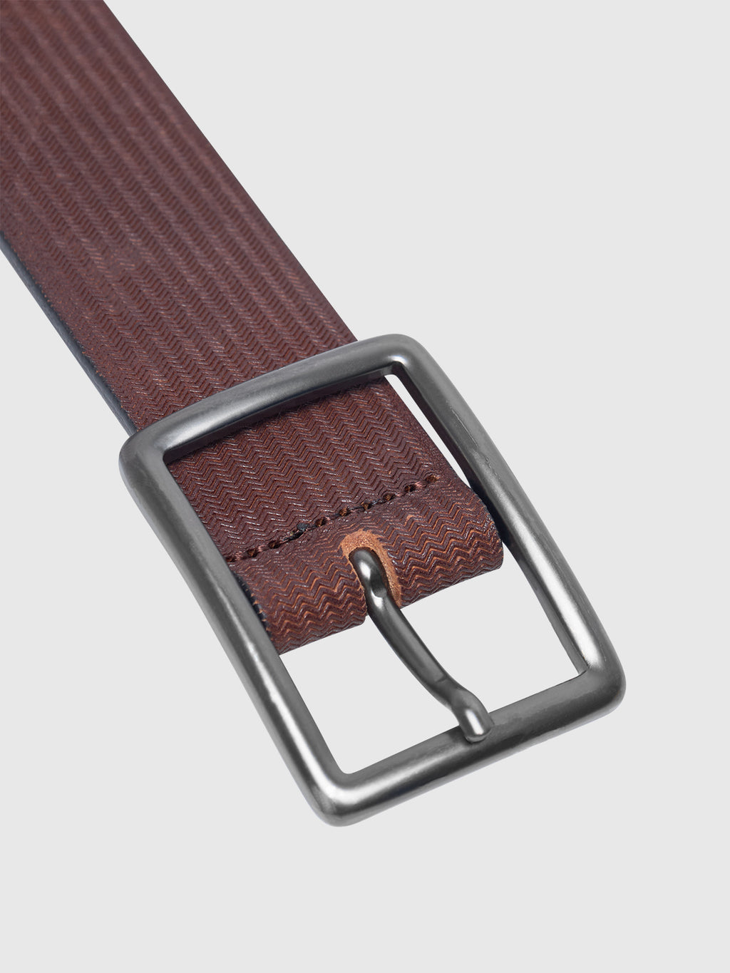 A close-up of the Gabba Godrone Belt - Brown highlights its textured genuine leather and rectangular silver buckle against a plain white background.