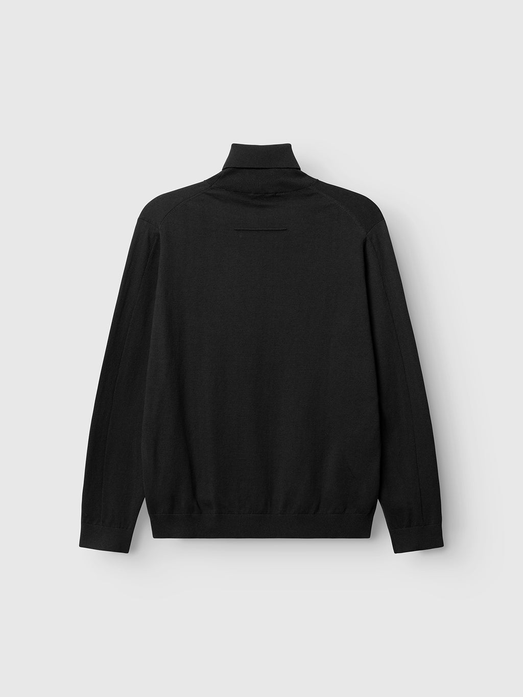 The Aris Prex - Black sweater by Gabba is shown flat against a light gray background, featuring the back view with its classic roll neck and long sleeves.