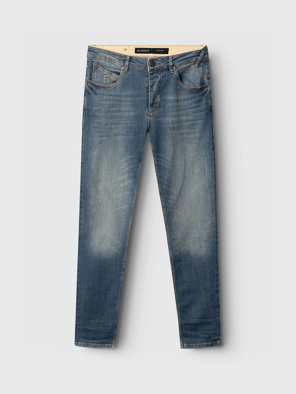 Rey 44617 Jeans by GABBA feature a blue denim wash with a slightly faded look, classic five-pocket design, and button-zipper closure. Perfect for a laid-back style, theyre shown against a light gray background.