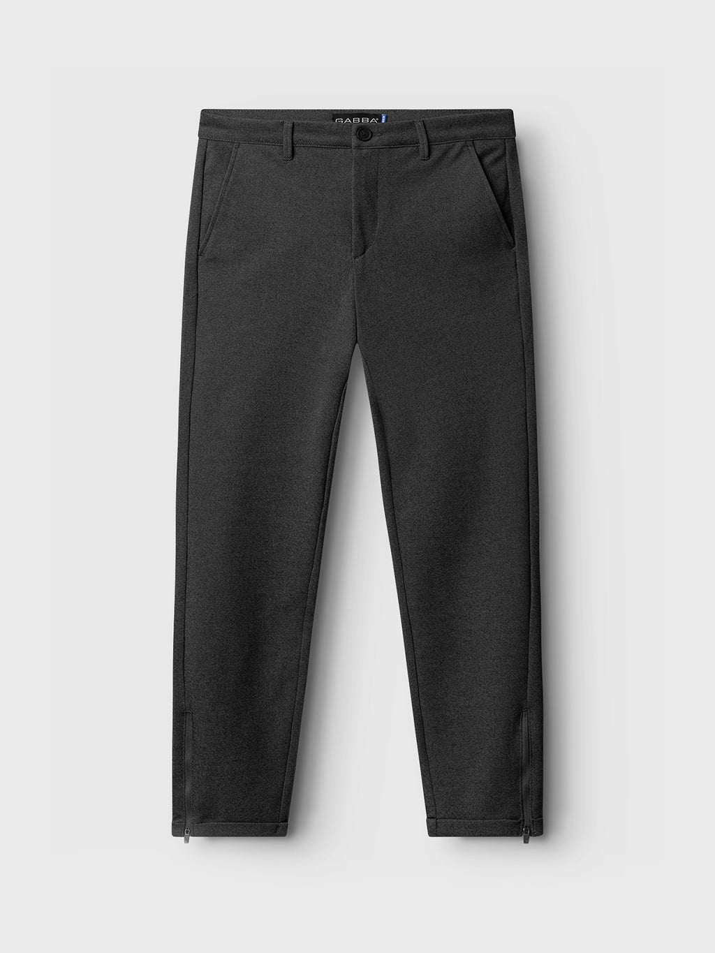 The Pisa Jersey Pant - Grey Mel by GABBA, featuring a tapered fit, side pockets, a visible button on the waistband, and ankle zippers for a metro look, is showcased on a light gray background. High-stretch fabric enhances comfort and ease.
