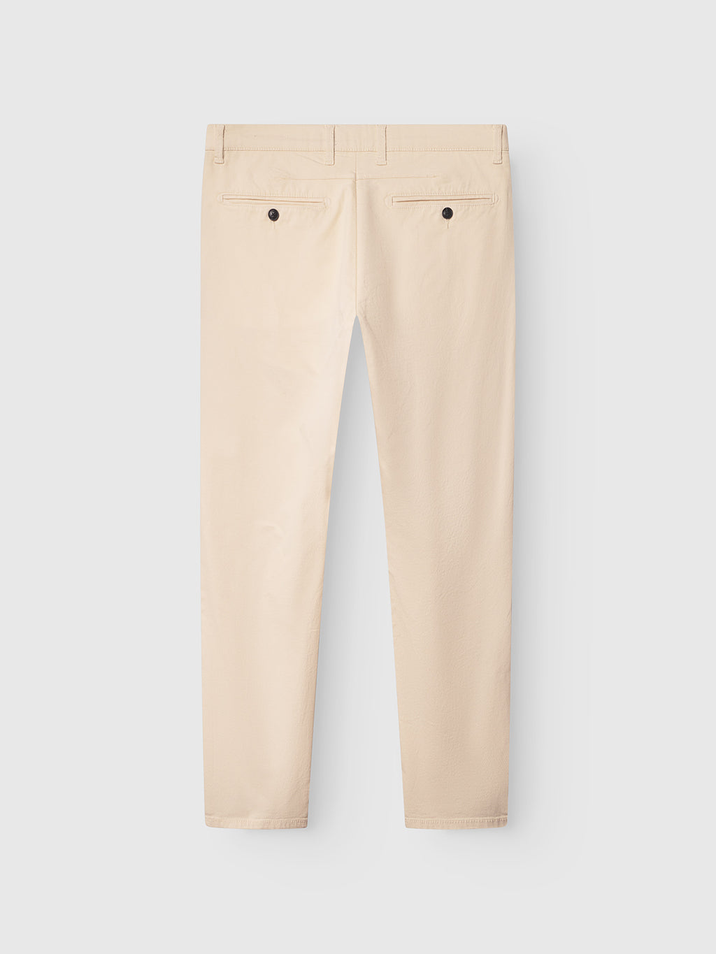 Rear view of the Paul K3280 Dale Chino in Ecru Light by Gabba against a light gray background, showcasing belt loops, stylish French pockets, branded buttons, and a straight leg cut.