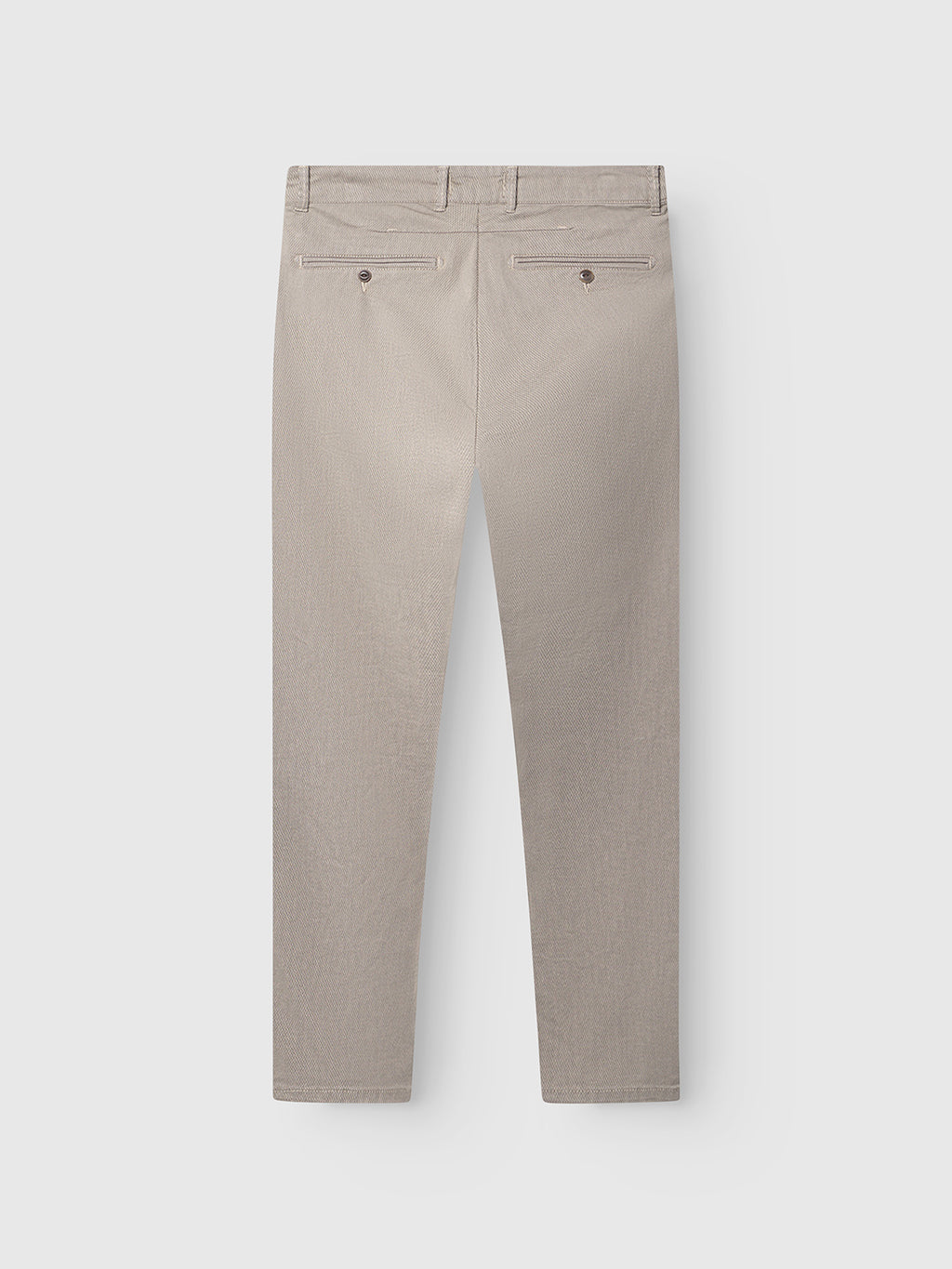 Back view of GABBA Paul K3280 Dale Chino in humus: slim fit, light beige, with two buttoned welt pockets, French pockets, belt loops, and branded buttons, laid flat on a white background.