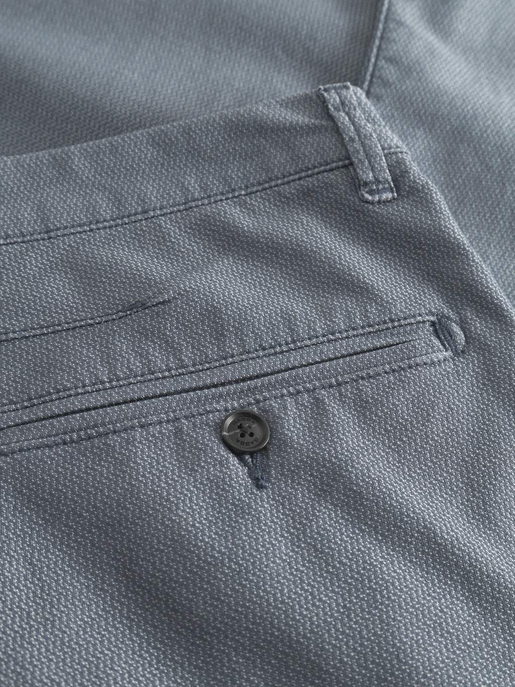 Close-up of the Gabba Paul K3280 Dale Chino in blue, showcasing its slim fit, textured fabric, welt and French pockets, plus a small black branded button.