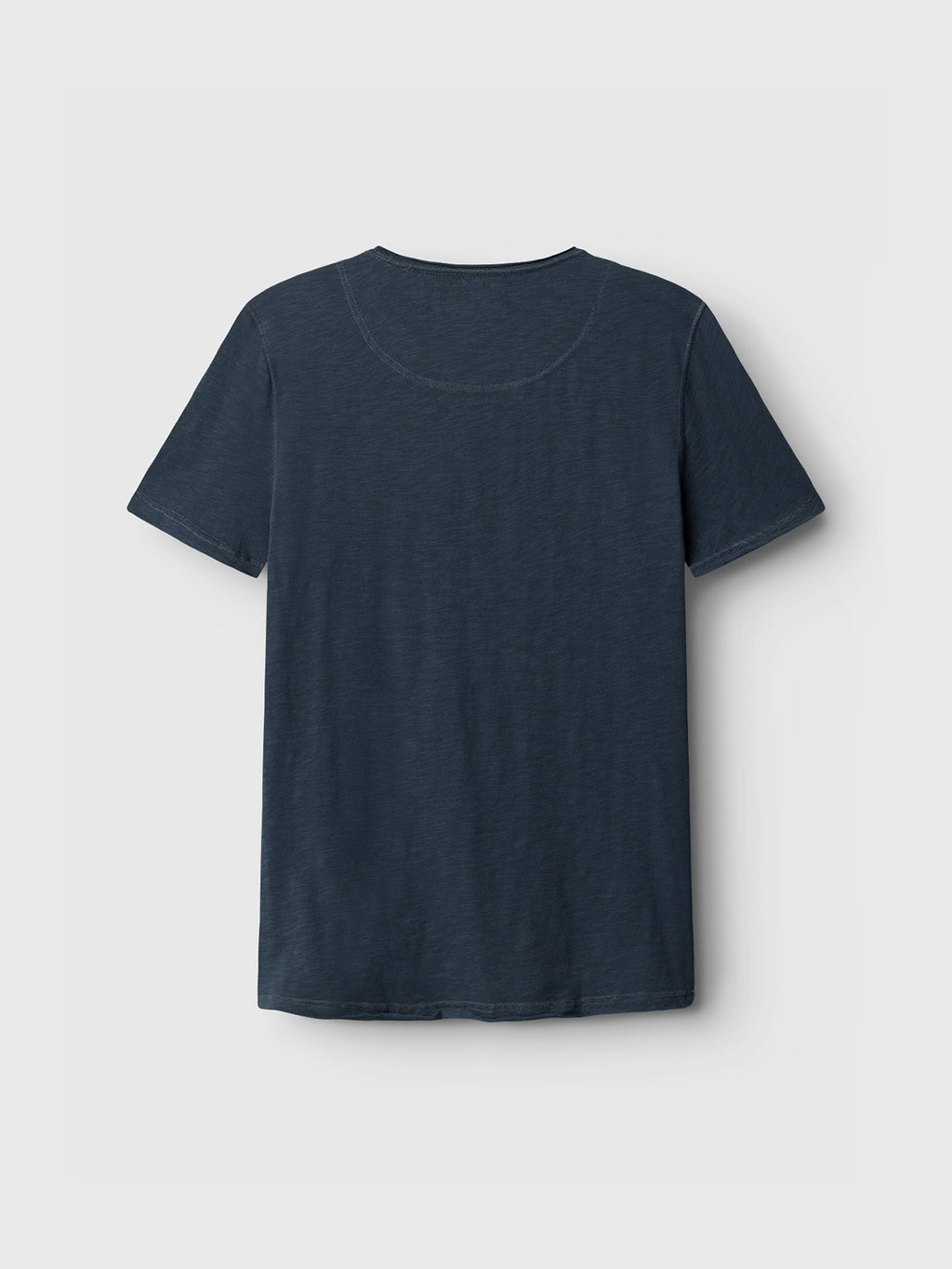 The Konrad Straight Slub Tee by GABBA, in navy, is showcased from the back on a light gray backdrop. This basic T-shirt features a simple round neckline and short sleeves for comfort, crafted from 100% cotton. Perfect for a casual look.