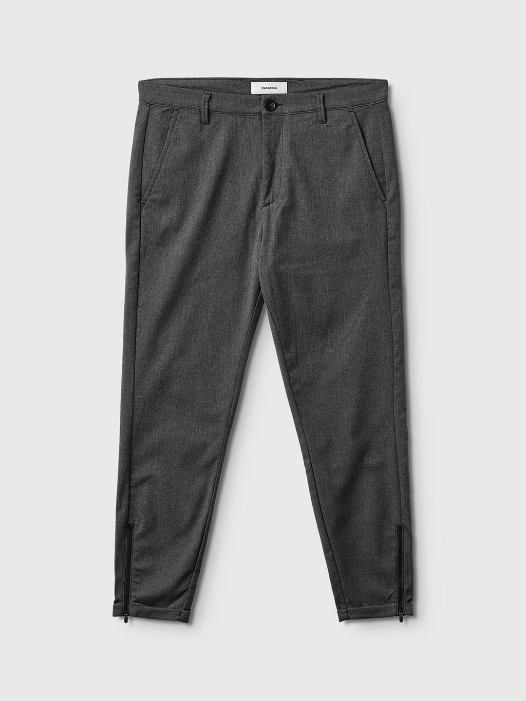 The Gabba Pisa Domo Pants in dark grey feature high-stretch fabric, side and back pockets, belt loops, ankle zippers, and a front button-zip closure, shown flat on a light gray background for sleek metro style.