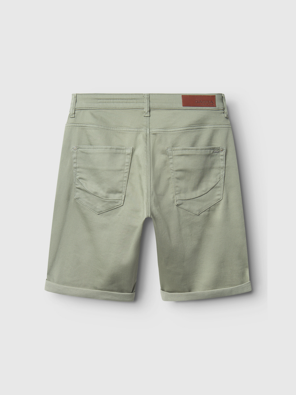 The Gabba Jason K3995 SANZA Shorts in light green feature two back pockets, stitched details, rolled cuffs, and a brown waistband patch. Crafted from super-stretch denim for comfort, shown against a plain white background.