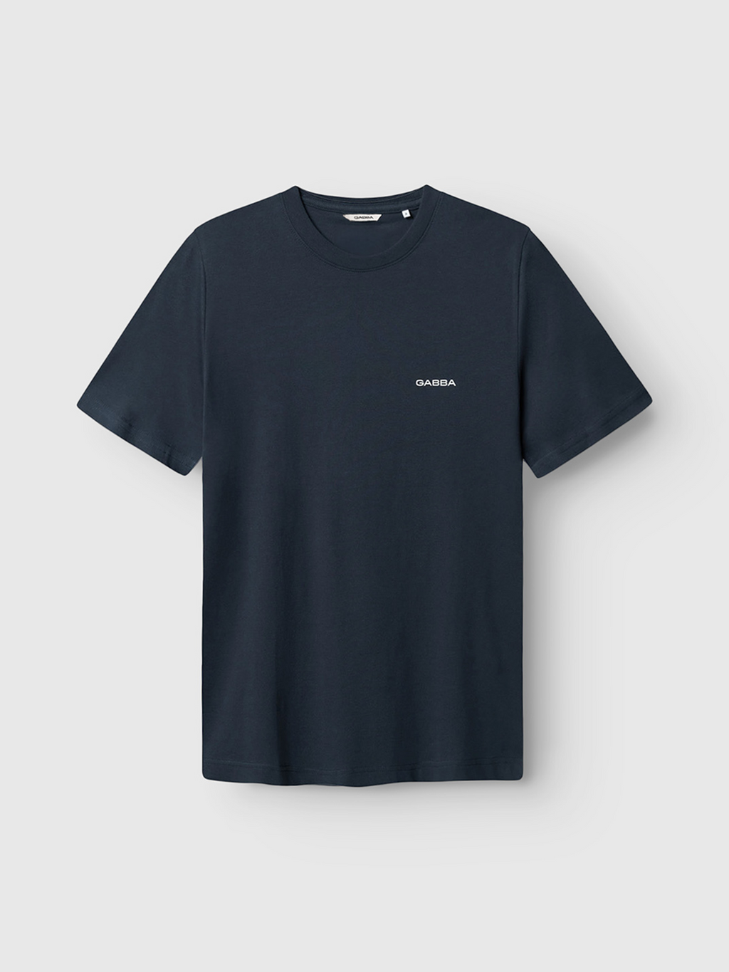 The Gabba Dune Logo SS GOTS - Total Eclipse is a plain black organic cotton t-shirt with a small Gabba logo on the left chest, shown against a light gray background.