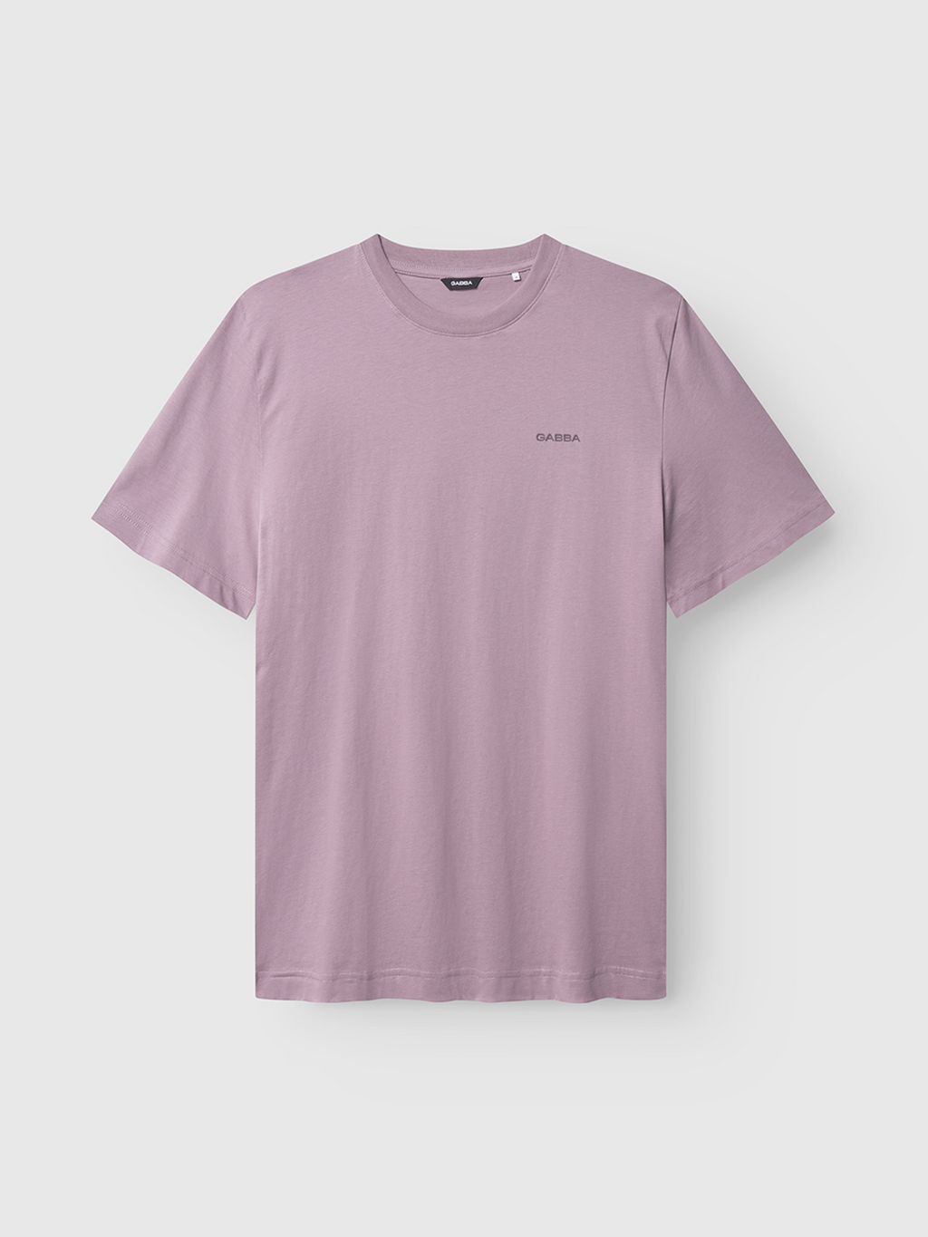The Gabba Dune Logo SS GOTS in Dust Purple is a light purple, short-sleeve crew neck t-shirt made from soft organic cotton, featuring a subtle logo on the left chest and shown on a plain white background.