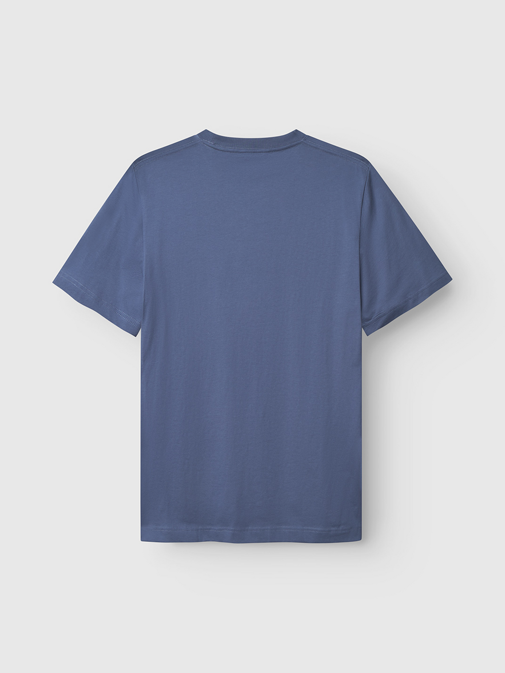 The Gabba Dune Logo SS GOTS t-shirt in Vintage Indigo is laid flat, back side up, on a white background. This classic fit, short-sleeved crew neck features a muted blue shade.