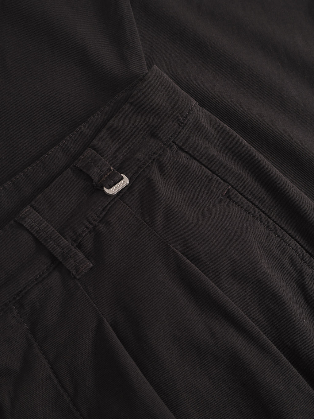 Close-up of Gabba Firenze Lubo - Black chinos showing the worker cut waistband, belt loop with a black belt, and part of a tucked-in shirt. The relaxed tapered fit, fabric texture, and stitching details are visible.