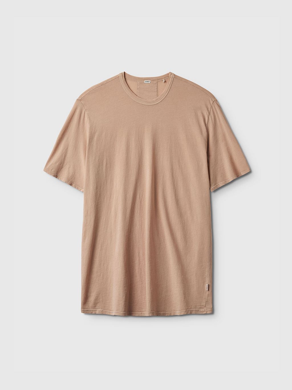 The Gabba Lagos SS - Safari is a beige short-sleeve crew neck t-shirt shown on a white background. Its classic fit and subtle branding near the hem make it a versatile, relaxed wardrobe essential.