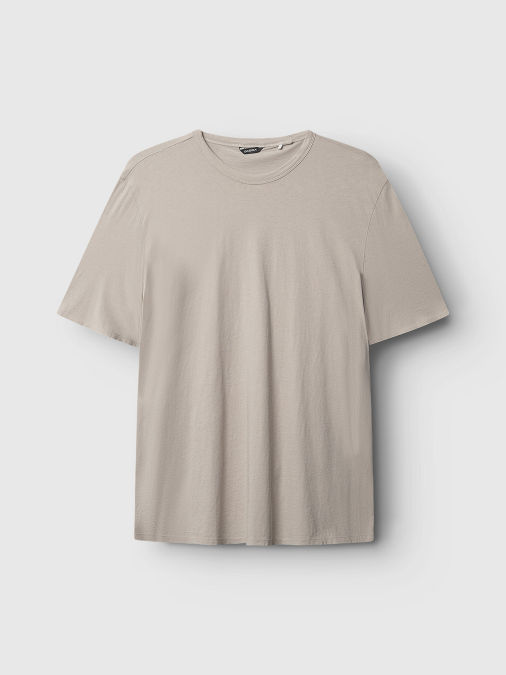 The Gabba Lagos SS - Sand is a classic fit t-shirt in light beige with a comfortable round neckline, making it a versatile wardrobe essential, shown against a plain white background.