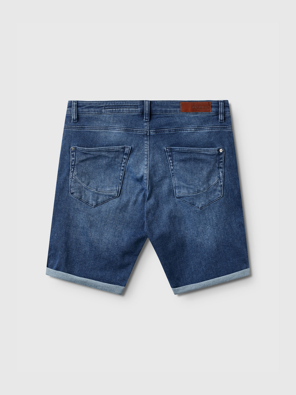 The Gabba Jason K3787 SANZA Shorts in mid-blue denim feature two back pockets, rolled-up hems, belt loops, and a brown leather patch—ideal for spring and summer style.