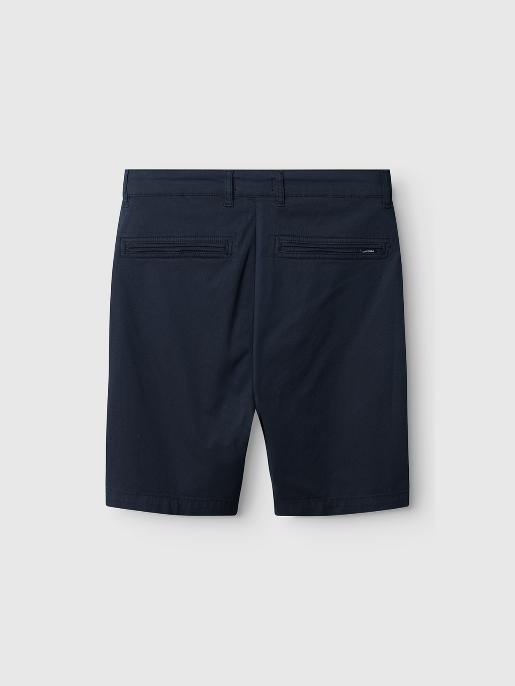 The Gabba Jet K3280 Dale Shorts in navy, shown from the back with two welt pockets and a brand tag above the right pocket, offer modern design and effortless style against a light gray background.