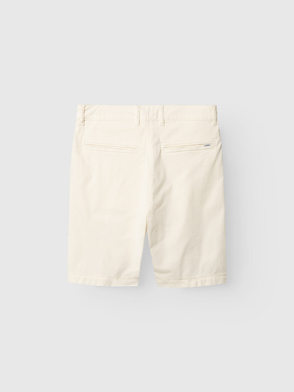 Back view of Gabba GABjet K3280 Dale Shorts in white, featuring a relaxed fit, belt loops, two back welt pockets, and a subtle brand tag above the right pocket, crafted from textured fabric against a light gray background.