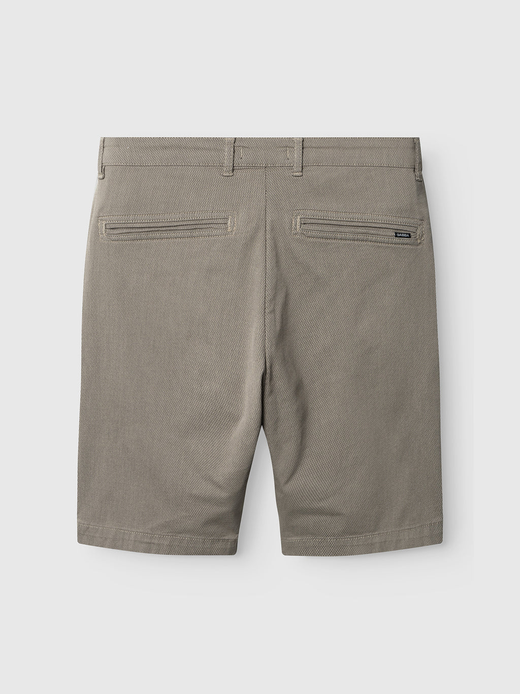 Back view of the Gabba GABjet K3280 Dale Shorts in Humus, featuring belt loops, two back welt pockets, and a zippered right pocket, displayed against a plain light background. These shorts offer a timeless design and a comfortable fit.