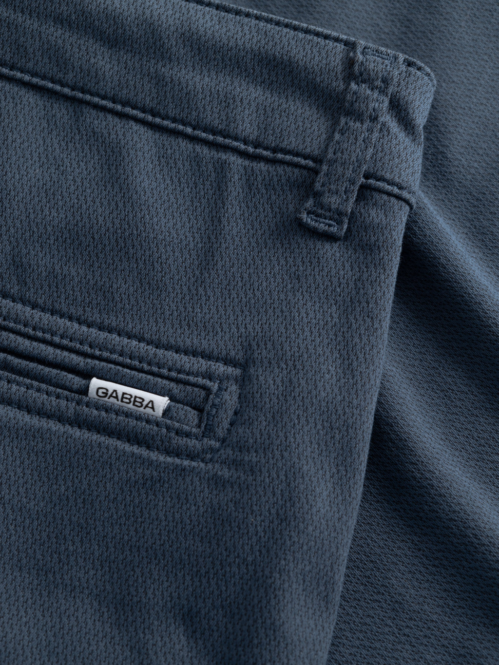 Close-up of GABjet K3280 Dale Shorts - Bering Sea by Gabba, showing dark blue textured fabric, a small “GABBA” label next to a back pocket, and classic angled front pockets—ideal for everyday wear.