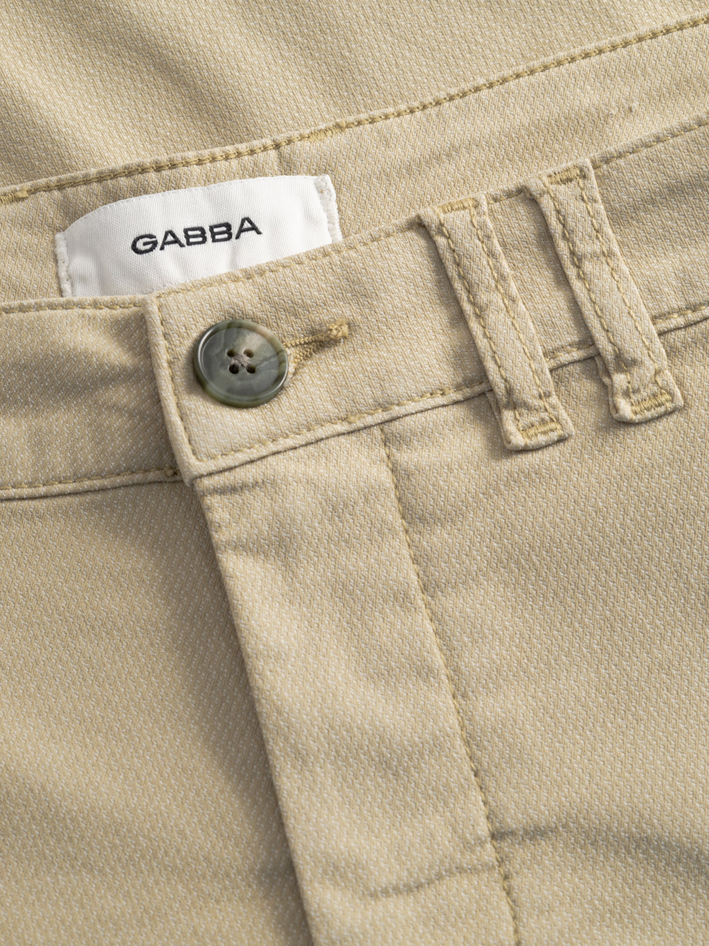 Close-up of GABjet K3280 Dale Shorts by Gabba in Alfa Green, featuring a button, belt loops, visible stitching, and a white GABBA label—versatile shorts designed for relaxed fit and all-day comfort.