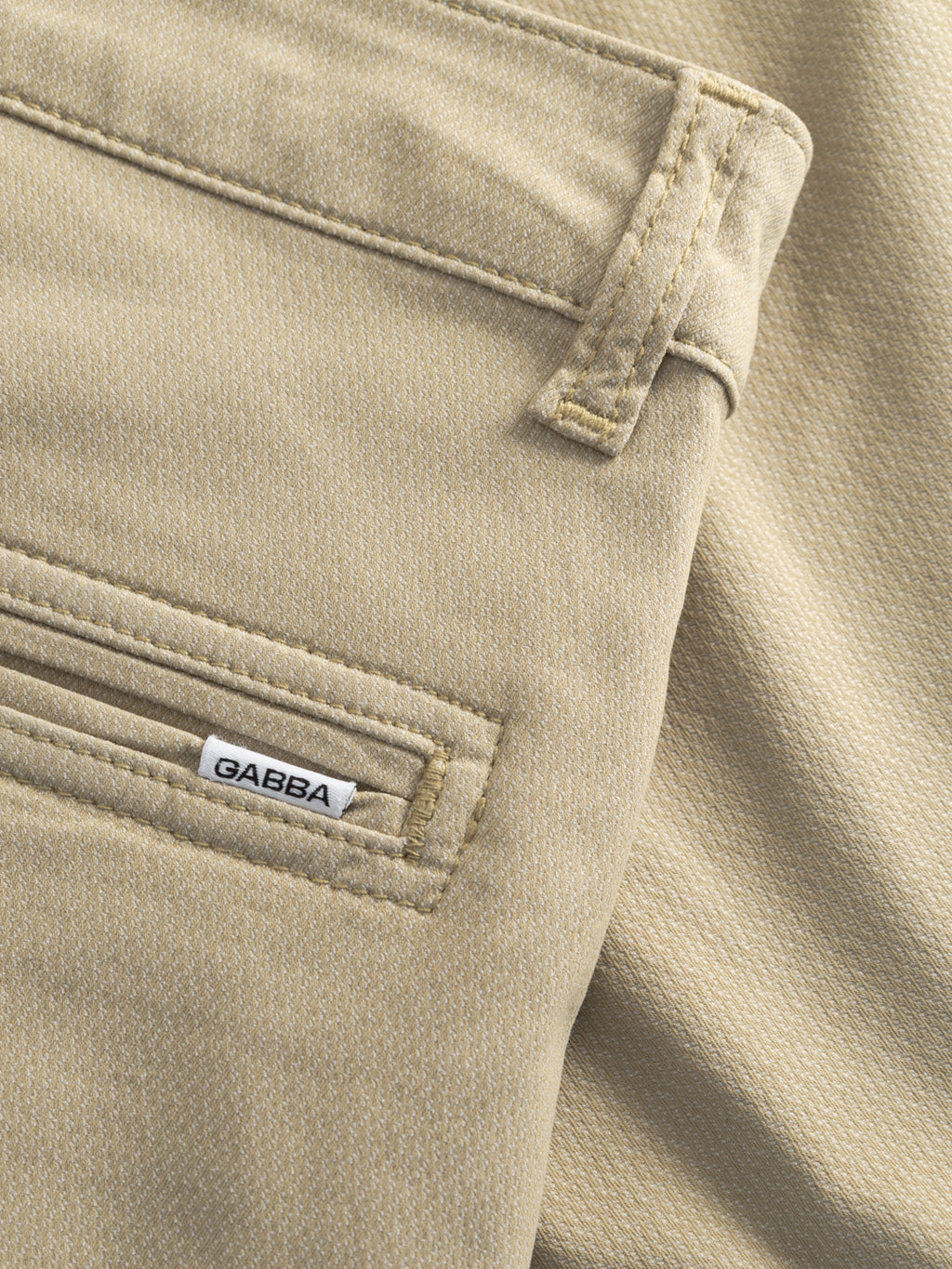 Close-up of GABjet K3280 Dale Shorts by Gabba in Alfa Green, showcasing a textured fabric, back pocket with a small white Gabba label, visible stitching, and the same relaxed fit as your favorite comfortable shorts.