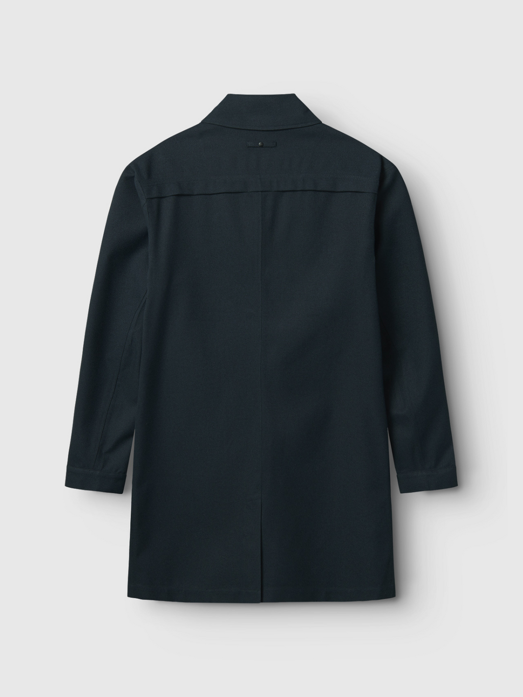 A long-sleeved, knee-length navy Emerson Bru jacket by Gabba is shown from the back against a plain light background. Its simple, straight-cut design has no visible embellishments, making it ideal for various weather conditions.