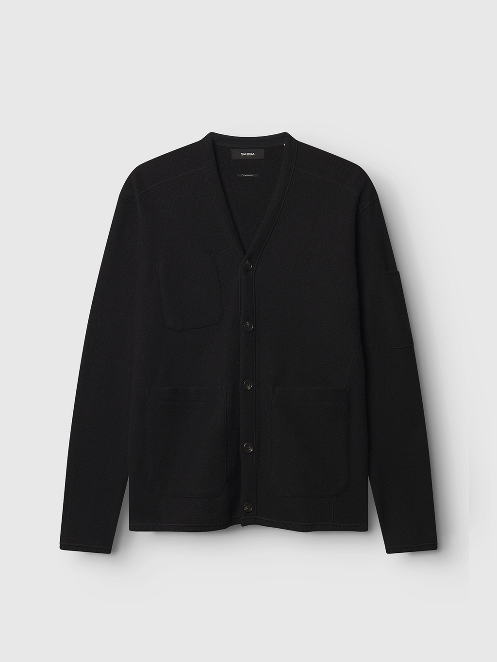 Gabbas Mattia Ls - Meteorite is a black V-neck cardigan made from boiled wool on a light gray backdrop, featuring a button-down front, long sleeves, and three pockets: two at the waist and one sleeve pocket on the chest.