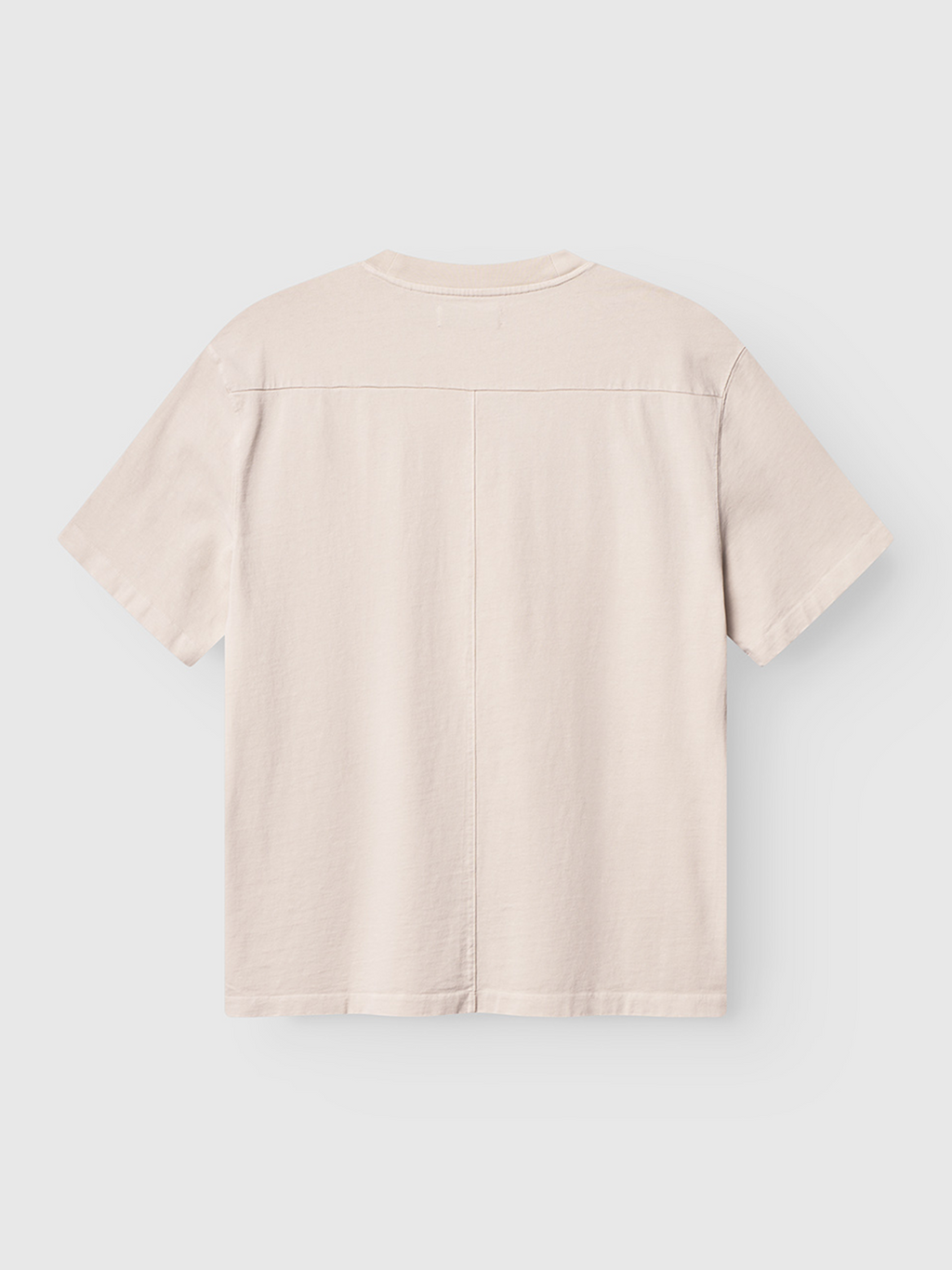 The Gabba Nigel Wix Boxy Hour SS in White Almond is a plain, boxy T-shirt shown from the back against a white background. Made of structured cotton, it features simple stitching with no visible patterns, logos, or decorations.