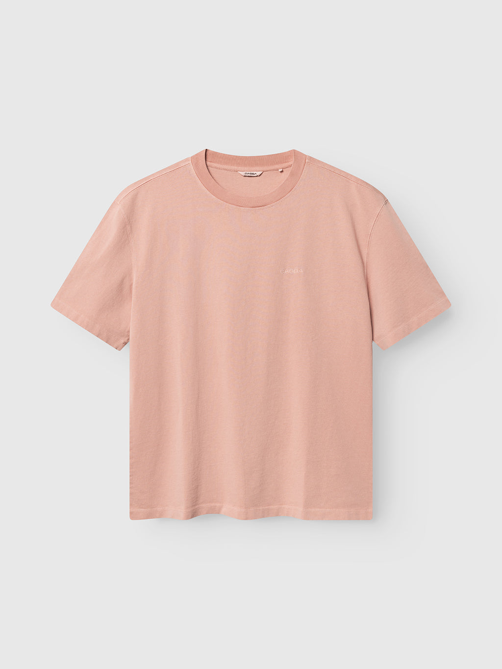 The Gabba GABnigel Wix Boxy Hour SS in Misty Rose is a light pink, short-sleeve boxy t-shirt made from soft heavyweight cotton, shown on a white background for lasting comfort and style.