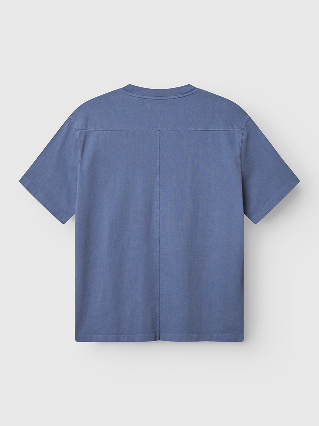 The Gabba Nigel Wix Boxy Hour SS t-shirt in vintage indigo is displayed flat, back side up, on a light gray background.