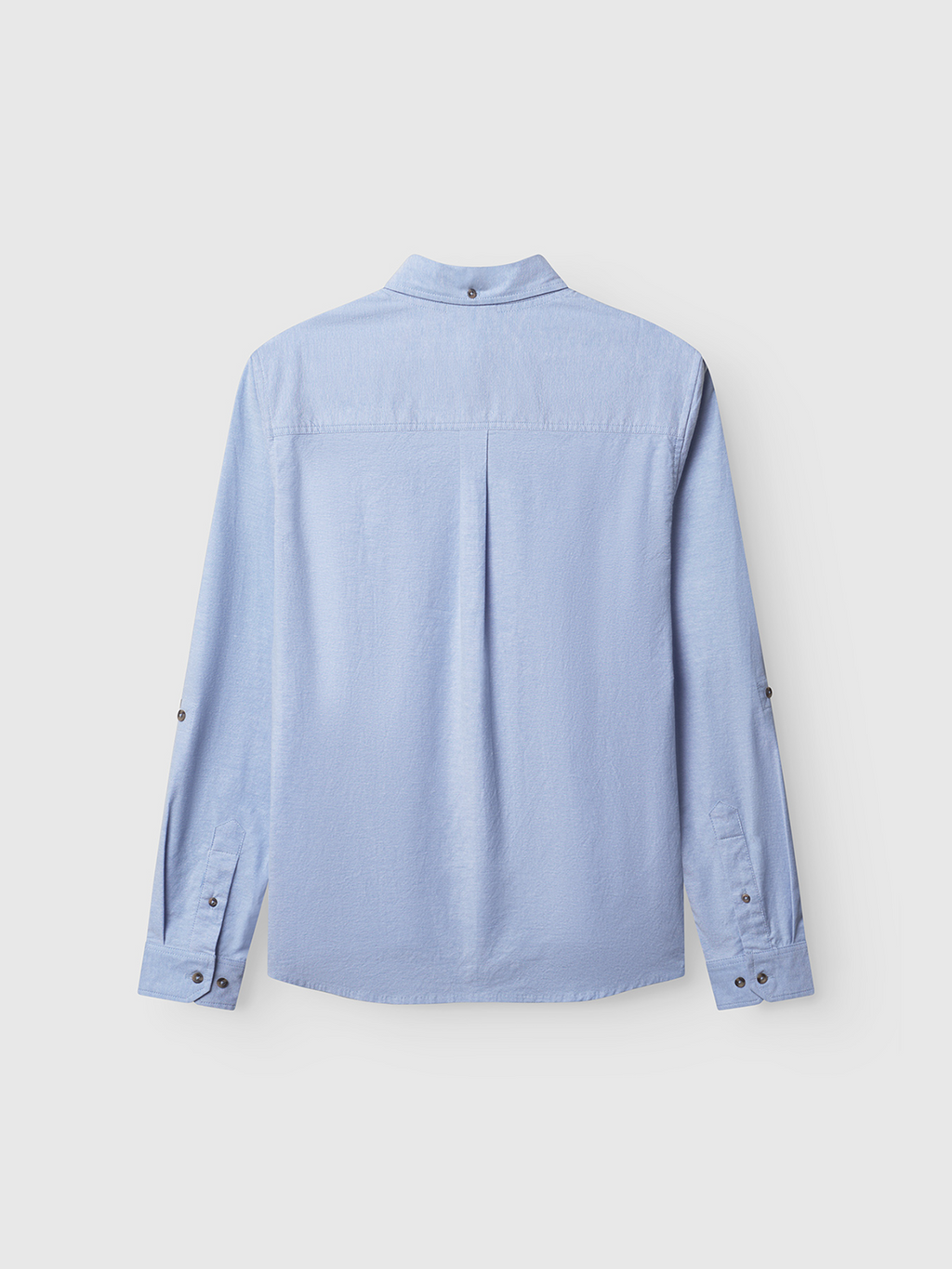 The Gabba Bent Reg Ox LS in light blue offers all-day comfort with a fold-over collar, buttoned cuffs, center back box pleat, and sleeve button plackets for easy rolling up. The soft cotton fabric has a subtle texture.
