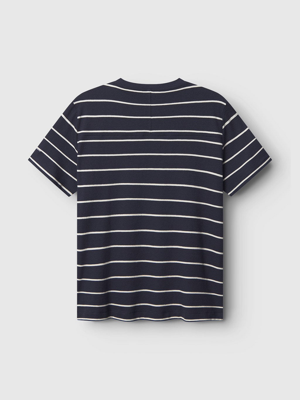 The Gabba Dune Crepe Stripes SS GOTS - Navy Stripe is a short-sleeve t-shirt in navy with thin white horizontal stripes, made from soft organic cotton, shown from the back against a plain light background.