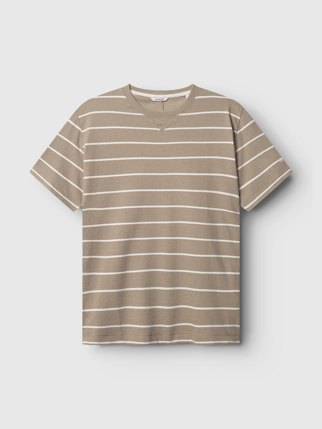 The Gabba Dune Crepe Stripes SS GOTS - Brown Stripe is a tan organic cotton t-shirt with white horizontal stripes, a crew neck, and relaxed fit, shown on a plain white background.