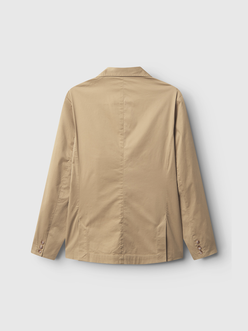 The Josh Unite - Sand blazer by Gabba is shown from the back, with long sleeves and cuff buttons, a center seam, and side vents at the hem. Made from soft cotton stretch fabric in tan against a white background.