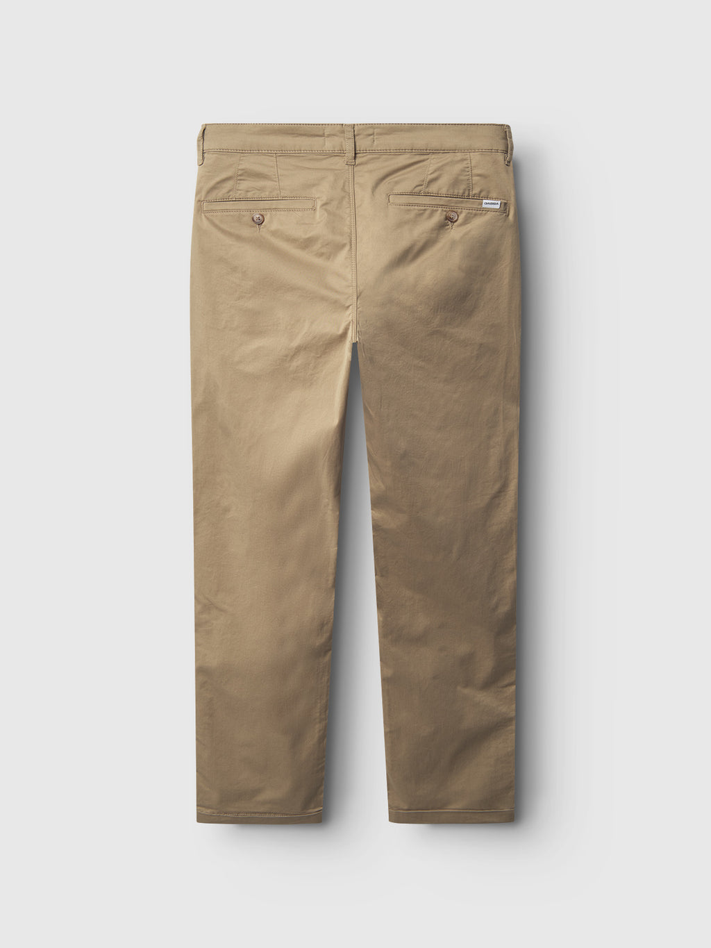 The Monza Unite - Sand pants by Gabba are shown from the back against a white background, featuring a khaki color, two buttoned back pockets, an elastic waist, and belt loops along the waistband.