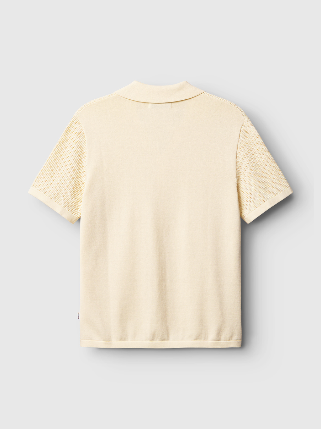 A back view of Gabbas Geno Resort SS - Ecru Light sweater against a light gray backdrop. This cream-colored short-sleeve knit features a flat collar and ribbed sleeve texture for a subtle retro flair.