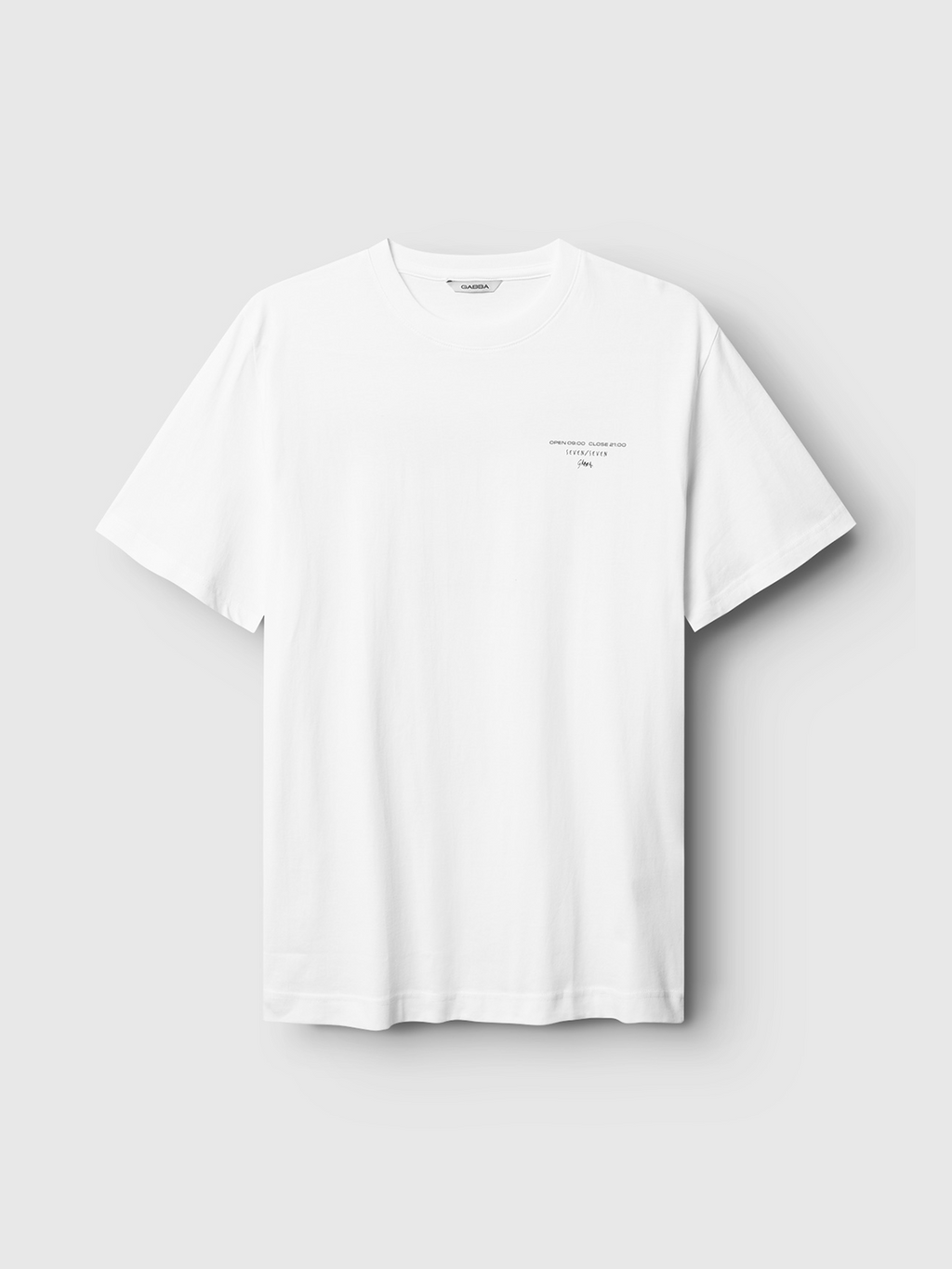 The Gabba Dune Kiosk B SS GOTS - White is a premium t-shirt in soft organic cotton, shown on a light gray background with minimal text detail on the left chest.