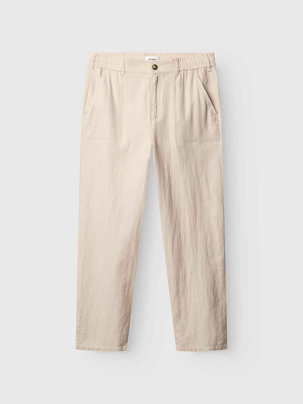 The Gabba GABzeta Lino - Birch features beige straight-leg linen pants with an elastic waistband, button closure, and two front pockets, displayed flat on a white background.
