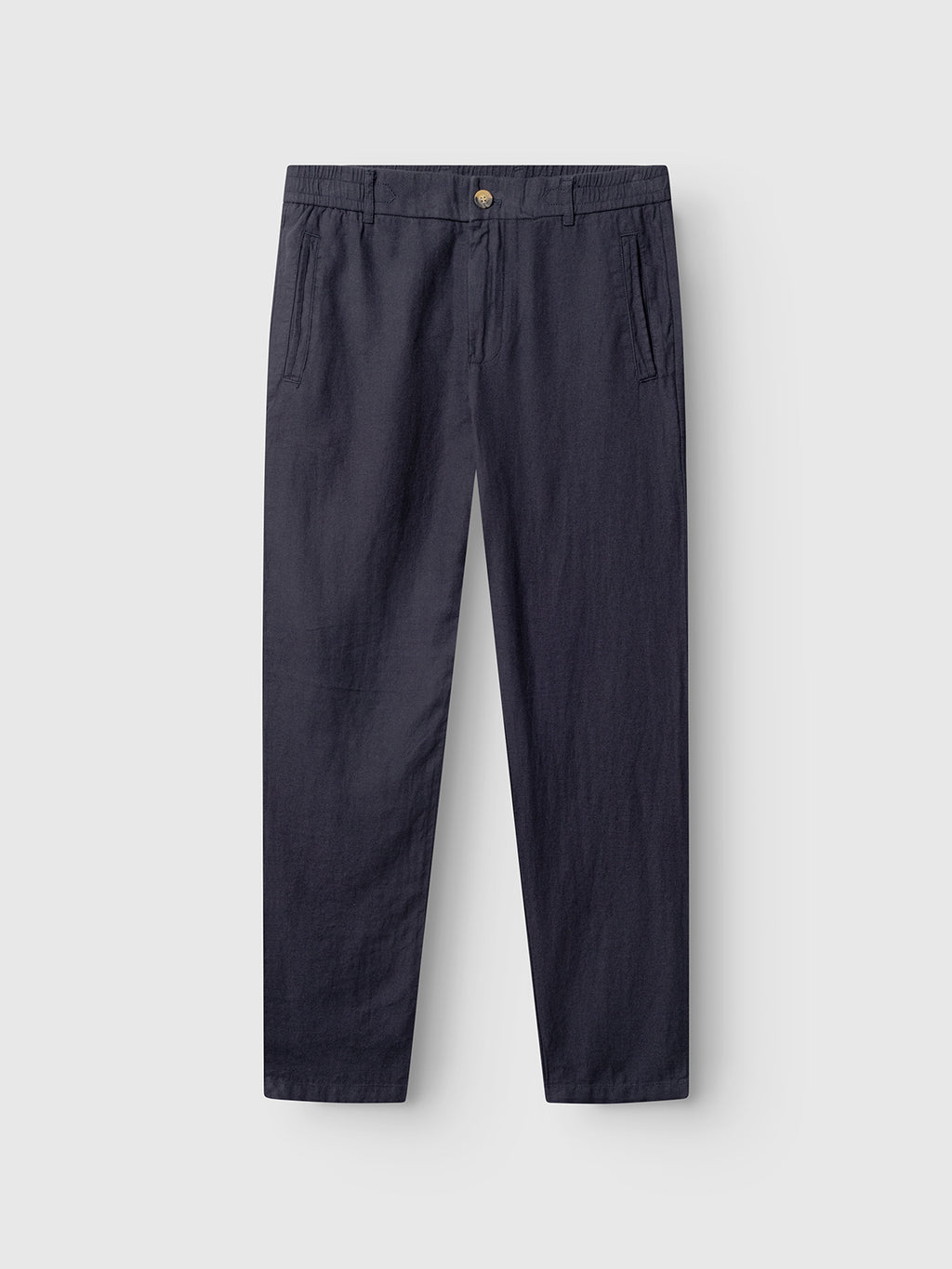 The Gabba Monza Lino Cropped pants in Night Sky, designed for comfort with straight legs, side pockets, and a button closure, are shown laid flat on a light background.