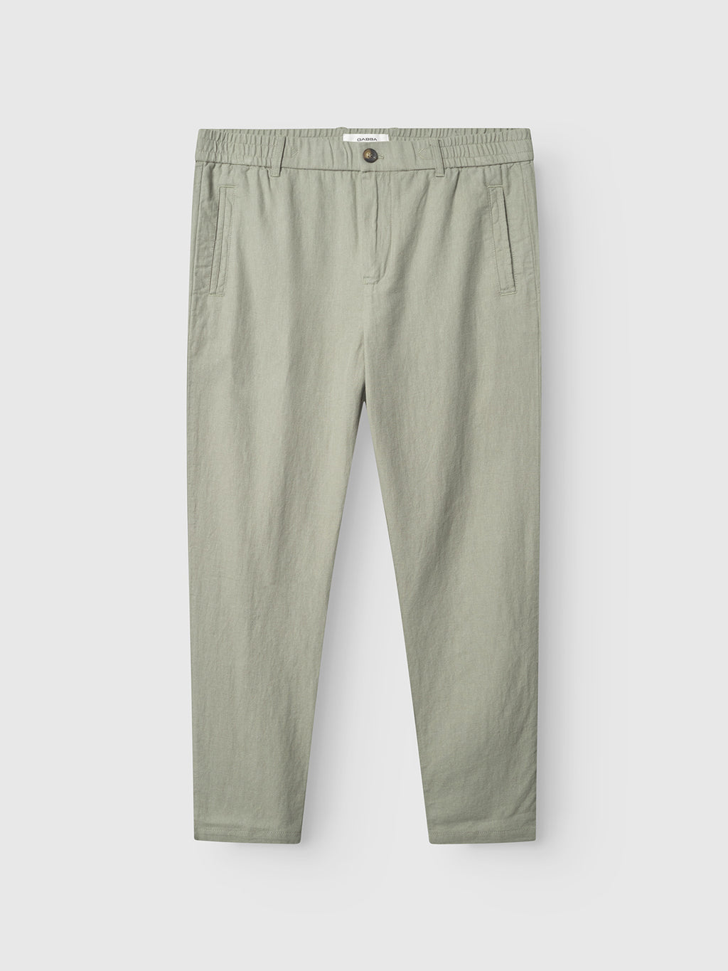 Gabba Monza Lino Cropped pants in light green, featuring a relaxed straight fit, classic silhouette, elastic waistband with button closure, and side pockets—shown flat on a white background for effortless comfort.