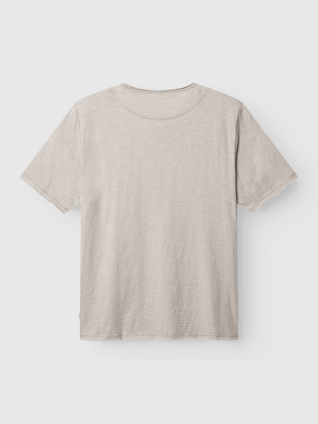 The Gabba Kostant New SS in Grey Paloma is a relaxed-fit slub fabric t-shirt with a classic crew neck and simple design, shown laid flat on a white background with the back visible.